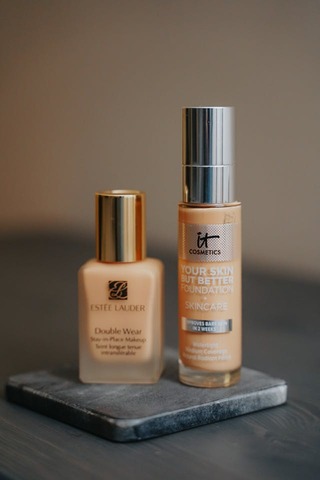 close up of 2 bottles of foundation. Best foundation. how to apply powder foundation. How to choose makeup foundation. Makeup foundation types. Makeup foundation tips. Types of foundation makeup. what is foundation makeup.