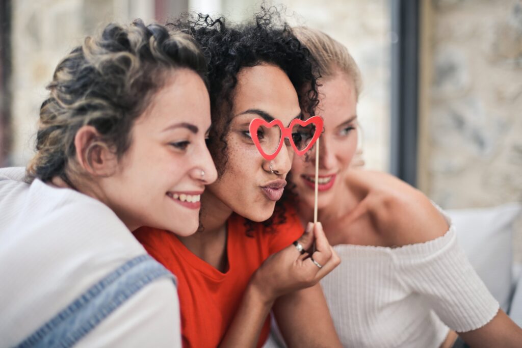 3 women friends taking a selfie with funny glasses. galentines dinner ideas. February 13th. galentines day ideas. when is galentines day. girls night cocktails. girls night dinner ideas. girls night snack ideas. girls night in ideas.what to do for girls night. what to do on a girls night. Girl dinner.