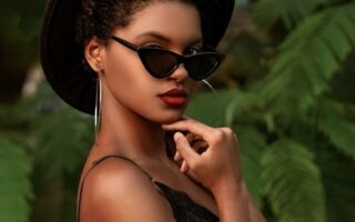 beautiful stylish young woman posing in sunglasses. good habits. good habits examples. what are good habits. what is one of the core habits practiced by the most successful people? non negotiable examples. Work life balance tips. how to balance work and family life.