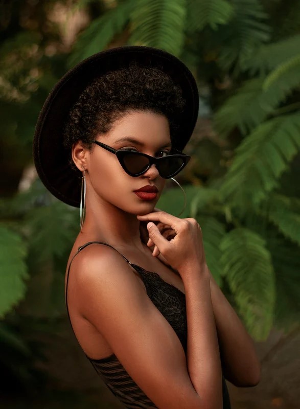 beautiful stylish young woman posing in sunglasses. good habits. good habits examples. what are good habits. what is one of the core habits practiced by the most successful people? non negotiable examples. Work life balance tips. how to balance work and family life.