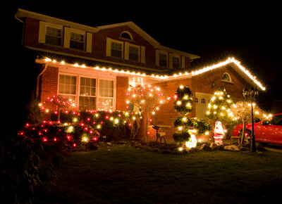 Night photography of Christmas lights decorating a house. Surviving Christmas. Surviving Christmas. Self care and how to glow up. New Year's Eve. christmas self care. Stress-free Christmas season.