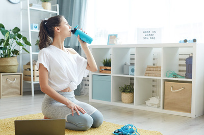 quick morning workout,
morning home workout, woman drinking water