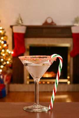 closeup of christmas candy cane martini. Christmas girls night. Christmas party. Christmas ladies night. holiday girls night. Christmas cocktails. girls night in. holiday party theme. ugly sweater party. 